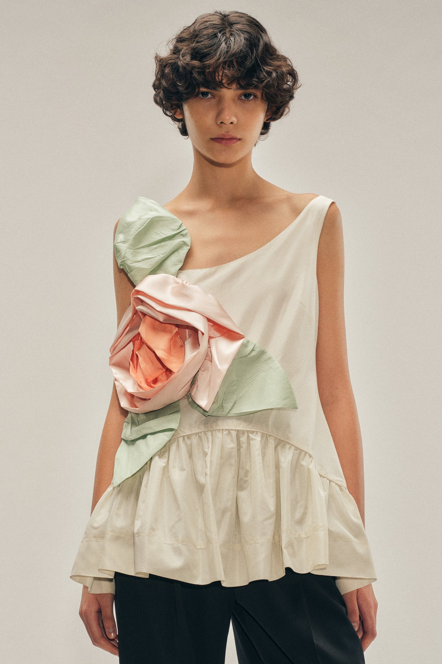 Pressed Rosette Tilted Neck Peplum Top